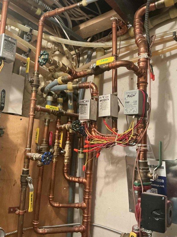 Responded to no heat call on 10-year-old boiler system displaying 109 ignition error code. Upon inspection, diagnosed multiple failed components including main control board, malfunctioning touchscreen interface, and failed automatic air vent. System was unable to provide heat to building or hot water to side arm tank. Documented extensive electrical wiring configuration and hydronic piping arrangement with zone valves and control relays. Presented customer with options for complete system replacement versus comprehensive repair of all failed components due to age of equipment and extent of necessary repairs.