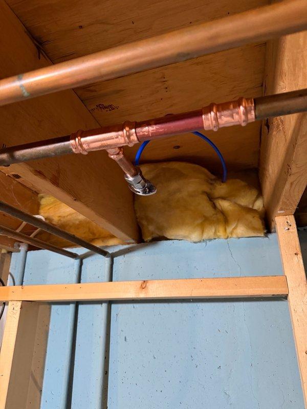 Removed existing dishwasher and installed new customer-supplied unit. Replaced section of copper piping to accommodate new angle stop valve for refrigerator water line. Installed new refrigerator supply line to ensure proper connection and water flow. Updated plumbing connections beneath kitchen sink area to meet current code requirements and integrate new appliance configuration with existing drain assembly and water supply system.