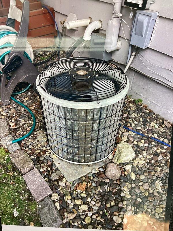 Performed comprehensive AC tune-up on aging R22 system experiencing inadequate cooling performance. Conducted electrical diagnostics using clamp meter to verify system operation, tested capacitor functionality, and checked refrigerant charge levels. Both capacitor and refrigerant levels were found to be within acceptable parameters. Despite proper component operation, unit demonstrated reduced cooling efficiency consistent with age-related degradation of R22 equipment. Discussed system replacement options with homeowner due to limitations of aging technology and diminishing performance capacity.
