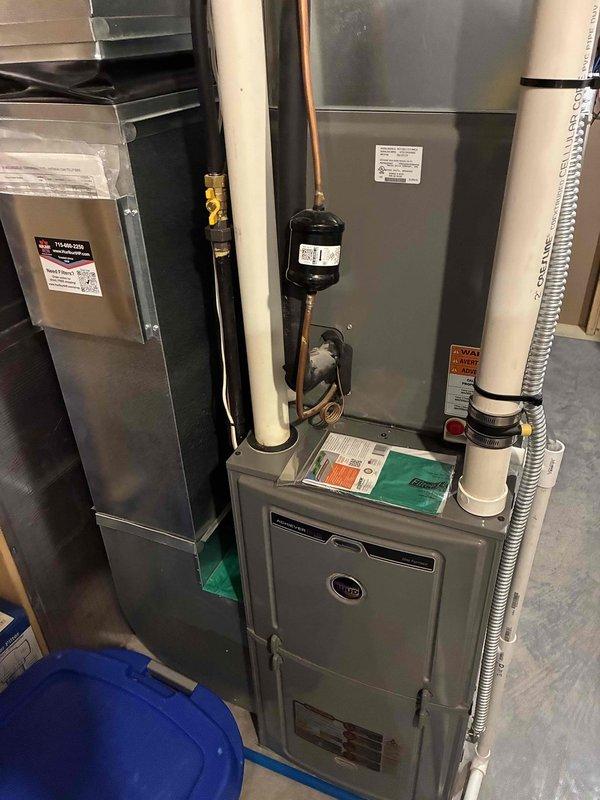 Completed preventative maintenance on a 6-year-old Rheem air conditioning system. Cleaned outdoor condenser coil, verified capacitor and contactor readings within manufacturer specifications, inspected and confirmed air filter condition, and cleared condensate drain line. Measured refrigerant charge and temperature differential at 19 degrees, both within normal operating parameters. System operating properly with no deficiencies noted.