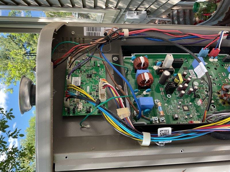Responded to no-cooling call on 4-year-old AC unit displaying 202 error code. Upon inspection, discovered rodent damage to compressor top cap wiring and physical damage to front logo panel from improper service attempt. Replaced damaged compressor top cap with new OEM component, reconnected all electrical connections, and performed complete system operational test through full cooling cycle with satisfactory results at 40°F superheat.