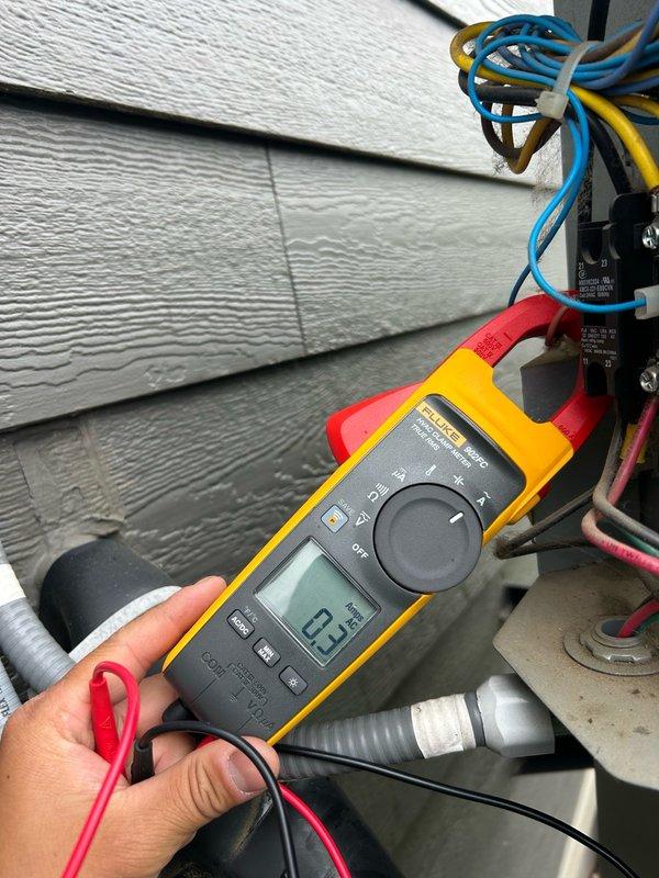 Completed annual air conditioning maintenance tune-up on residential HVAC system. Performed comprehensive inspection including thermostat operation verification, air filter assessment, blower assembly examination, outdoor coil condition check, and electrical component testing. Evaluated contactor, capacitor, and condensate drain functionality. Measured refrigerant operation and temperature split across the system using digital multimeter and clamp meter on electrical connections. All readings recorded within normal operating parameters with no mechanical deficiencies or safety concerns identified. Confirmed proper cooling operation throughout the system including air handler, ductwork, and humidifier components. System operating as designed with no repairs required at this time. Recommend continued seasonal preventative maintenance to maintain peak efficiency and monitor normal component wear as equipment ages.