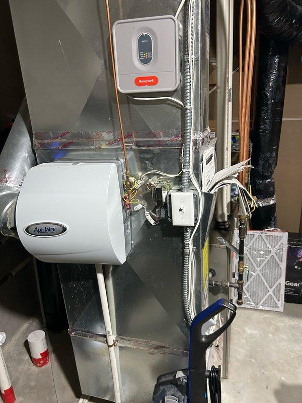Completed annual air conditioning maintenance tune-up on residential HVAC system. Performed comprehensive inspection including thermostat operation verification, air filter assessment, blower assembly examination, outdoor coil condition check, and electrical component testing. Evaluated contactor, capacitor, and condensate drain functionality. Measured refrigerant operation and temperature split across the system using digital multimeter and clamp meter on electrical connections. All readings recorded within normal operating parameters with no mechanical deficiencies or safety concerns identified. Confirmed proper cooling operation throughout the system including air handler, ductwork, and humidifier components. System operating as designed with no repairs required at this time. Recommend continued seasonal preventative maintenance to maintain peak efficiency and monitor normal component wear as equipment ages.