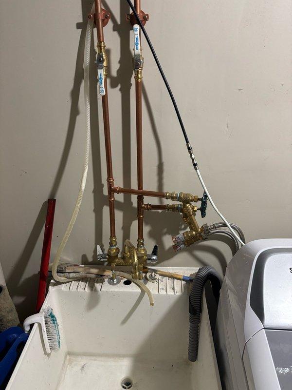 # Biannual Plumbing Inspection

Performed comprehensive plumbing system inspection including water heater flush, sump pump operational test, and full evaluation of residential water distribution lines. Inspected laundry supply hoses and shut-off valves at washing machine connection point, confirmed proper installation and condition of all components. Conducted leak inspection of all bathroom and kitchen plumbing fixtures including faucets, drains, and supply connections. Performed water hardness test which indicated elevated mineral content exceeding 10 grains per gallon, recommending consideration of water softening system for future installation. All mechanical systems including sump pump, shut-off valves, supply lines, and fixture connections found to be in good working order with no leaks detected. Visual inspection of copper supply piping, brass manifold assembly, and laundry room plumbing infrastructure confirmed secure mounting and proper connections throughout. Water heater mai