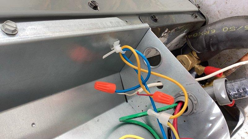 Responded to no cooling complaint on newly installed system. Upon arrival, discovered outdoor unit failing to engage due to improperly wired thermostat connections at the indoor air handler hub. Corrected Y and C wire positions at the terminal hub, restoring proper communication between thermostat and condensing unit. Verified system operation with all components functioning correctly and confirmed 20-degree temperature split across evaporator coil, indicating proper cooling performance.