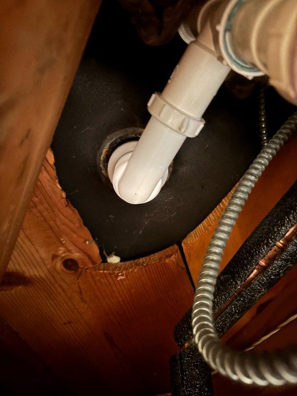 Responded to a bathtub drain leak caused by a cross-threaded and improperly sealed tub shoe. Removed the defective drain shoe and pop-up assembly, then installed new components with proper threading and silicone sealing. Tightened all connections and conducted a 10-minute water test by filling the tub and running water to verify complete leak elimination. No leaks were detected in the basement below. Fixture restored to full service.