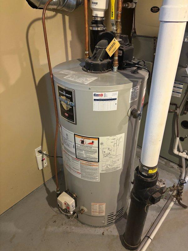 Responded to service call for leaking natural gas water heater. Upon inspection, confirmed active leak originating from bottom of existing tanked water heater unit. Assessed current installation including power vent configuration with 3" cell core venting system. Determined unit required full replacement due to tank failure and leak severity.

Evaluated utility room setup and existing plumbing infrastructure including copper supply lines, gas connections, and venting arrangement. Measured venting run and confirmed feasibility of upgrading to 2" solid core PVC venting system as part of replacement installation. Prepared comprehensive estimate for new power vent short natural gas water heater replacement, including specifications for updated venting materials and installation requirements. Documented existing equipment configuration and photographed current water heater condition, venting system, and surrounding plumbing connections for estimate reference. Property owners advised to revi