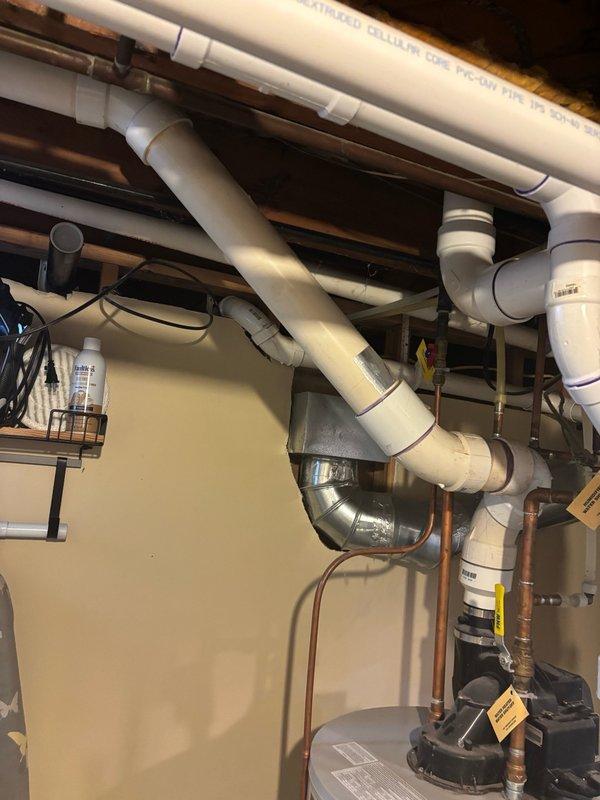 Responded to service call for leaking natural gas water heater. Upon inspection, confirmed active leak originating from bottom of existing tanked water heater unit. Assessed current installation including power vent configuration with 3" cell core venting system. Determined unit required full replacement due to tank failure and leak severity.

Evaluated utility room setup and existing plumbing infrastructure including copper supply lines, gas connections, and venting arrangement. Measured venting run and confirmed feasibility of upgrading to 2" solid core PVC venting system as part of replacement installation. Prepared comprehensive estimate for new power vent short natural gas water heater replacement, including specifications for updated venting materials and installation requirements. Documented existing equipment configuration and photographed current water heater condition, venting system, and surrounding plumbing connections for estimate reference. Property owners advised to revi