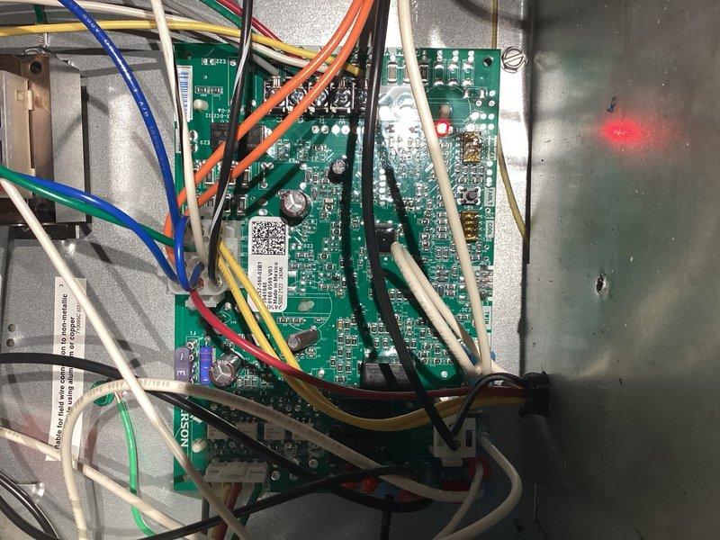 Responded to callback for AC system fan continuing to run after reaching setpoint temperature. Replaced thermostat and monitored system operation for approximately 20 minutes to verify proper cycling. Fan shut down within one minute after cooling call ended, indicating improved performance. Documented control board model number and captured photos for reference, as intermittent relay sticking on control board remains possible cause if issue recurs.