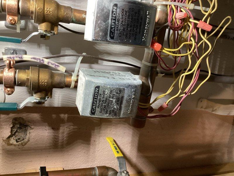 Performed comprehensive maintenance on dual air conditioning systems, completing full tune-ups including inspection of evaporator coils, blowers, air filters, condensers, capacitors, contactors, compressors, and refrigerant levels—both systems operating normally with recommendation to replace air filters in approximately one month. Replaced failed zone valve head on boiler system serving second floor rear bathroom zone, completed rewiring of new valve assembly, and verified proper operation. Performed thorough cleaning and maintenance on energy recovery ventilator (ERV) system which showed signs of neglect, including cleaning of prefilters and interior components to restore proper air exchange function.