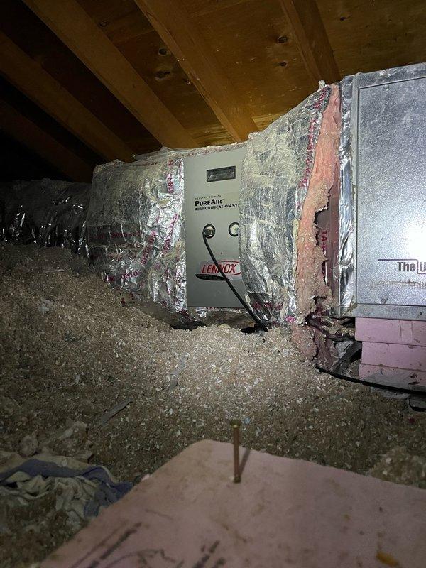 Completed annual AC maintenance tune-up on 10-year-old system. Removed panels and thoroughly rinsed heavily soiled condenser coil to restore proper airflow. Inspected electrical components with capacitor testing within specifications. Removed mouse nest from electrical compartment with no wire damage observed. Changed indoor air filter and verified UV light operation was functioning correctly, confirming thermostat notification was routine annual maintenance reminder. Checked evaporator drain line for proper drainage. System startup and operational testing confirmed proper function with 20-degree temperature split across the coil.
