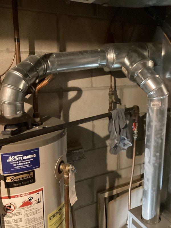 Responded to no hot water call on 12-year-old Kenmore tanked water heater. Upon arrival, confirmed pilot light was extinguished. Homeowner had attempted to relight pilot but was physically unable to kneel at unit access point for extended period required. Successfully accessed pilot assembly, followed proper lighting procedure, and restored pilot flame. Verified burner ignition, proper flame characteristics, and hot water system operation before completing service call.