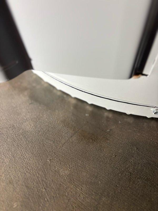 Responded to report of water leakage in basement utility area near a 10-year-old AO Smith 50-gallon gas power vent water heater. Conducted thorough inspection to determine leak source, as water softener equipment was also present in the immediate vicinity. Confirmed water heater was actively leaking from the base of the unit, indicating internal tank failure. Documented conditions with photographs showing the existing installation, including power vent assembly, copper piping connections, and current venting configuration. Identified that existing PVC venting was installed with cell core PVC, which does not meet current code requirements for power vent water heater applications. Informed homeowner of findings and recommended complete water heater replacement due to tank failure. Prepared detailed estimate for like-for-like replacement with comparable short 50-gallon power vent unit to maintain existing footprint and clearances in basement mechanical room. Estimate included dielectric u