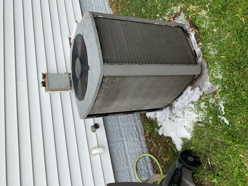 Responded to no cooling complaint on 10+ year old air conditioning system with frozen refrigerant line. Upon inspection, found evaporator coils heavily soiled with black buildup due to overdue air filter replacement. Performed complete system evaluation including coil cleaning, capacitor testing, and contactor inspection. Cleaned outdoor condenser coils and verified proper system operation. Obtained satisfactory temperature split across the system, confirming restored cooling capacity. Recommended seasonal furnace inspection for fall maintenance.