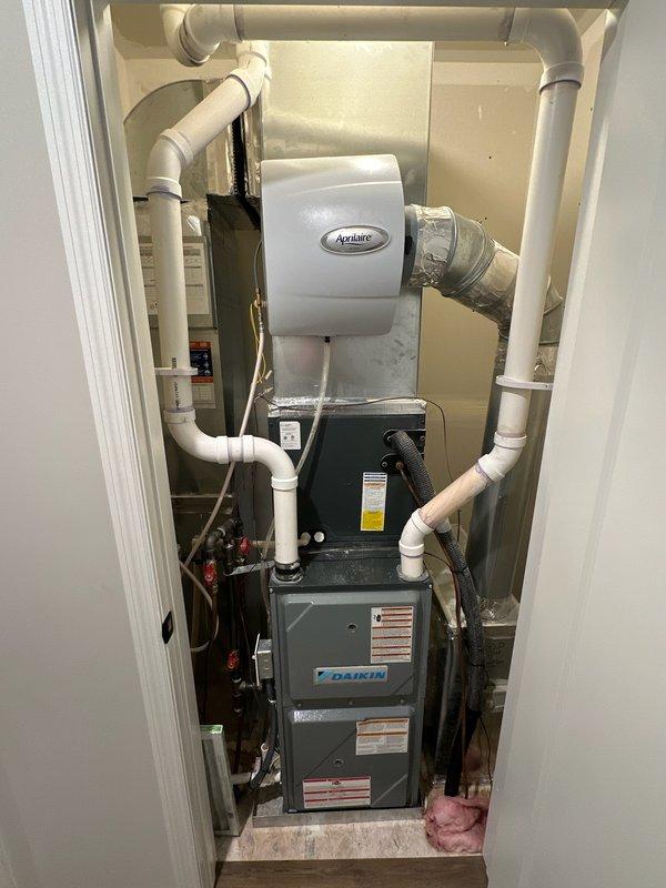 Responded to complaint of loud humming noise from furnace during operation. Diagnosed issue as humidifier solenoid running dry due to closed water supply valve. Opened water shut-off valve to humidifier, restoring water flow and eliminating excessive noise. Identified small leak at solenoid hose connection, disassembled fitting, replaced worn bushing, and reassembled connection. Verified leak repair, confirmed humidifier operating quietly with proper water flow, and ensured system functioning normally.