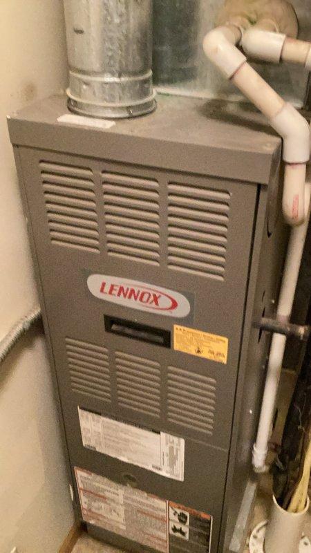 Responded to no cooling complaint on aging R22 system. Upon inspection, found evaporator coil frozen with excessive condensation and visible rust damage. Condenser unit operational but refrigerant charge critically low. Diagnostic readings revealed suction pressure below operational specifications with saturation temperature below freezing point. Measured suction line temperature at 79°F with superheat at 50°F, significantly exceeding the recommended 21°F superheat specification, confirming substantial refrigerant loss. Visual inspection documented heavily corroded evaporator coil with signs of chronic moisture intrusion and active leakage. Due to R22 refrigerant restrictions and inability to perform leak repairs on obsolete systems, recommended complete system replacement. Provided photographic documentation of rusted components and overall unit condition.