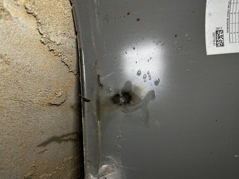 Responded to no cooling complaint with system completely inoperative. Found tripped low-voltage fuse at air handler. Upon inspection, discovered damaged thermostat wire at outdoor unit with exposed conductors causing short circuit, consistent with animal damage. Repaired compromised wiring and replaced low-voltage fuse. Performed complete condenser coil cleaning due to heavy dirt accumulation affecting system performance. Cycled system through heating and cooling modes, verified proper operation with no further fuse trips. Unit restored to normal cooling operation.