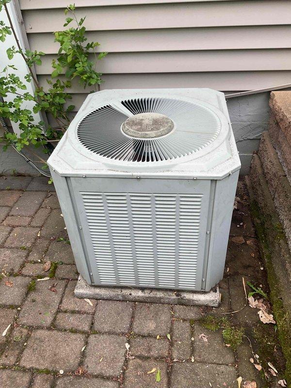 Responded to no cooling call on aging Trane XE 80 system with frozen refrigerant lines. Upon arrival, confirmed unit was shut down due to ice buildup on suction line. Diagnosed system as low on R-22 refrigerant. Allowed coil to thaw completely, then recharged system to manufacturer specifications and verified proper operation of both indoor and outdoor units before departure.