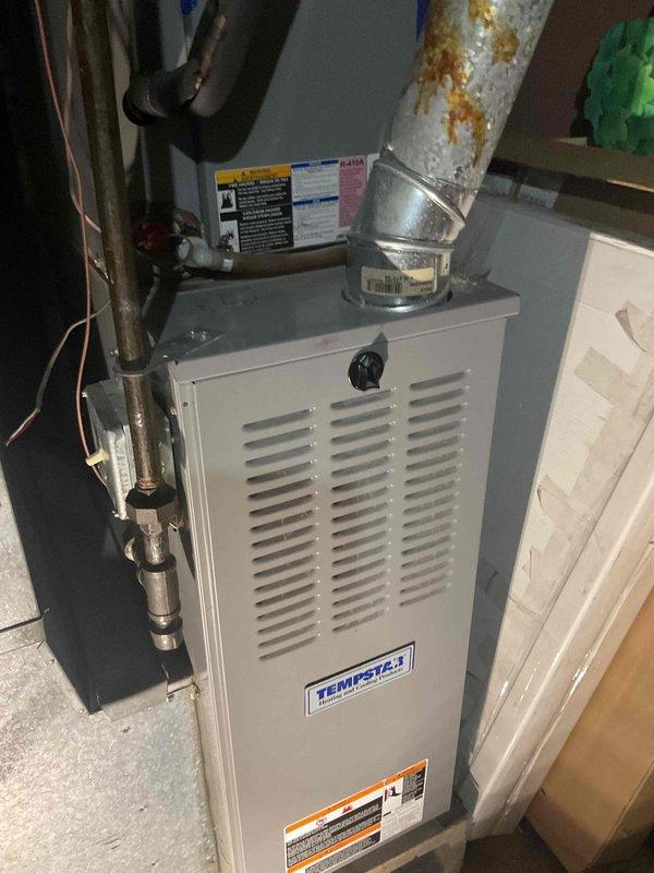 Responded to service call for short cycling furnace issue identified during heating inspection. Upon diagnostic evaluation, discovered cracked heat exchanger in TempStar furnace unit, which posed safety hazard and required immediate replacement. Documented existing conditions with photographic evidence showing compromised heat exchanger and furnace installation. Replaced entire furnace unit to resolve short cycling problem and eliminate safety concerns associated with cracked heat exchanger. System restored to proper operation and ready for homeowner's upcoming property sale.
