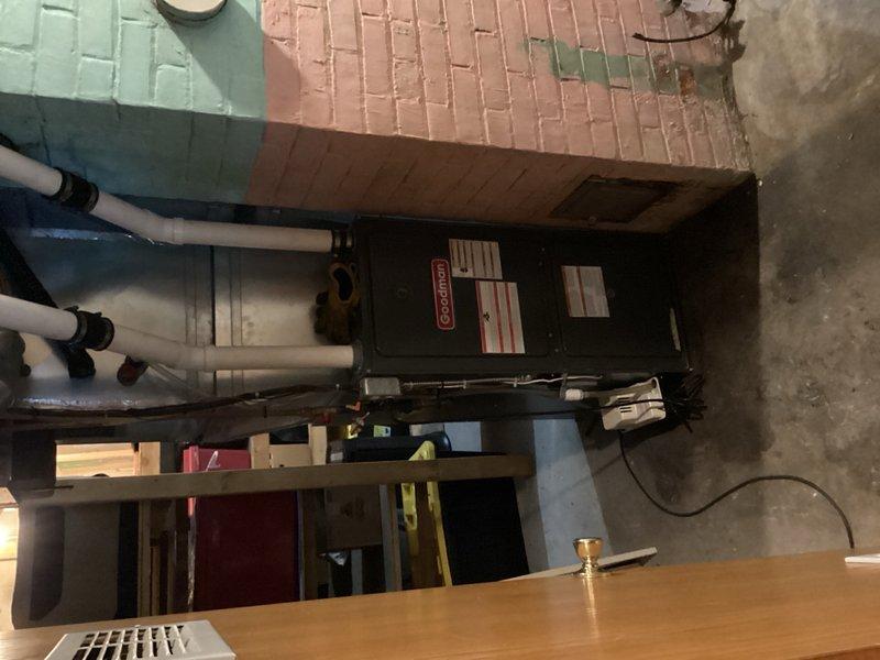 Performed comprehensive AC tune-up and inspection on 15-year-old system for new homeowner. Inspected all routine components including filter, blower motor, and evaporator coil, finding all clean with proper condensate drainage. Conducted electrical testing on outdoor unit, cleaned condenser coils, and verified system operation with 15-minute runtime test, confirming 17-18 degree temperature split despite low ambient load of 60 degrees, indicating optimal cooling performance.