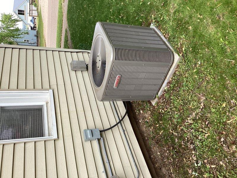 Responded to no cooling complaint on 2-3 year old Lennox central air system. Upon arrival, confirmed system was blowing warm air with no cooling capacity. Previous service history indicated refrigerant had been added along with UV dye approximately one year prior to identify leak source. 

Conducted thorough leak inspection of evaporator coil assembly. Observed UV dye splatter present inside ductwork and on evaporator coil panel. Noted thermostatic expansion valve (TXV) exhibited excessive oil accumulation on exterior surface. Applied soap bubble solution to TXV assembly while system was operating under pressure. Successfully isolated active refrigerant leak at TXV body housing. 

Documented findings with photographs of outdoor condensing unit and evaporator coil components including TXV valve assembly. Explained diagnostic findings to homeowner and demonstrated leak location at evaporator coil. Advised that warranty coverage and parts availability would need verification before procee