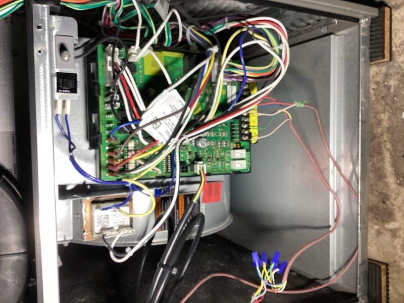 Responded to no cooling complaint on recently installed air conditioning system. Upon arrival, verified condenser unit and refrigerant levels were within normal parameters. Tested system operation by cycling from furnace control board, which functioned properly. When cycling from thermostat, unit received cooling call but failed to engage system. Performed jumper test on thermostat wiring and confirmed all connections were secure and intact. Diagnostics revealed faulty thermostat preventing system engagement. Replaced defective thermostat with new unit and cycled system through multiple cooling cycles to verify proper operation. System now operating normally with thermostat successfully communicating with equipment and engaging cooling mode on demand.
