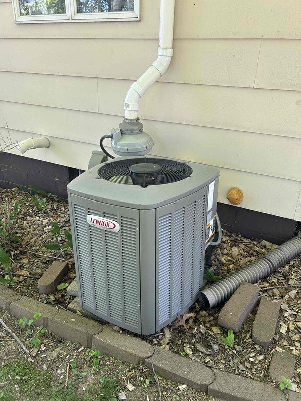 Responded to no cooling call on 15-year-old Lennox system. Upon arrival, found outdoor condenser fan motor not operating while indoor unit was running. Diagnosed failed condenser fan motor by testing capacitor, which read 4.0 microfarads. Replaced capacitor to verify motor failure, but motor still failed to start despite spinning freely by hand. Confirmed condenser fan motor requires replacement. Provided repair estimate to homeowner via email for approval before proceeding with motor replacement.