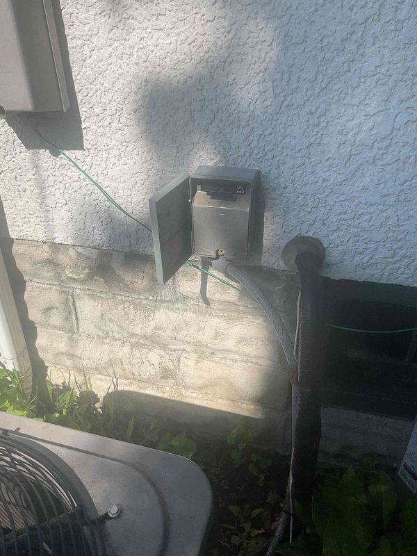 Responded to no cooling call on residential AC system. Traced thermostat wiring and discovered damaged wire section where two wire sets were spliced together from previous installation. Repaired faulty wiring connection and restored system operation.