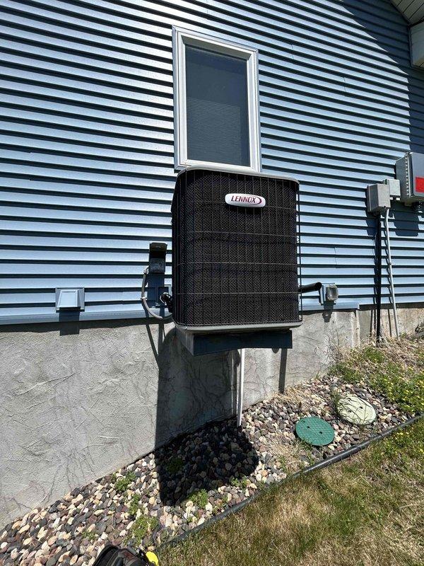 Responded to no cooling complaint on 19-year-old Lennox central air conditioning system. Upon inspection, diagnosed failed condenser fan motor causing loud squealing noise and preventing unit operation. Provided pricing for motor replacement and coordinated follow-up appointment for heat pump system replacement options per homeowner's request.