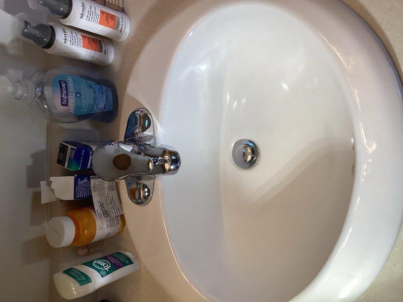 Completed comprehensive plumbing inspection of residential property with focus on bathroom fixtures and kitchen instant hot water system. Documented condition of bathroom facilities including toilet, sink, and associated fixtures, all found to be in functional working order. Identified electrical issue with instant hot water dispenser under kitchen sink, which is currently wired to same switched outlet as garbage disposal, preventing independent operation of the instant hot unit. Coordinated with electrical department to schedule service call for rewiring instant hot faucet to dedicated circuit for proper functionality.