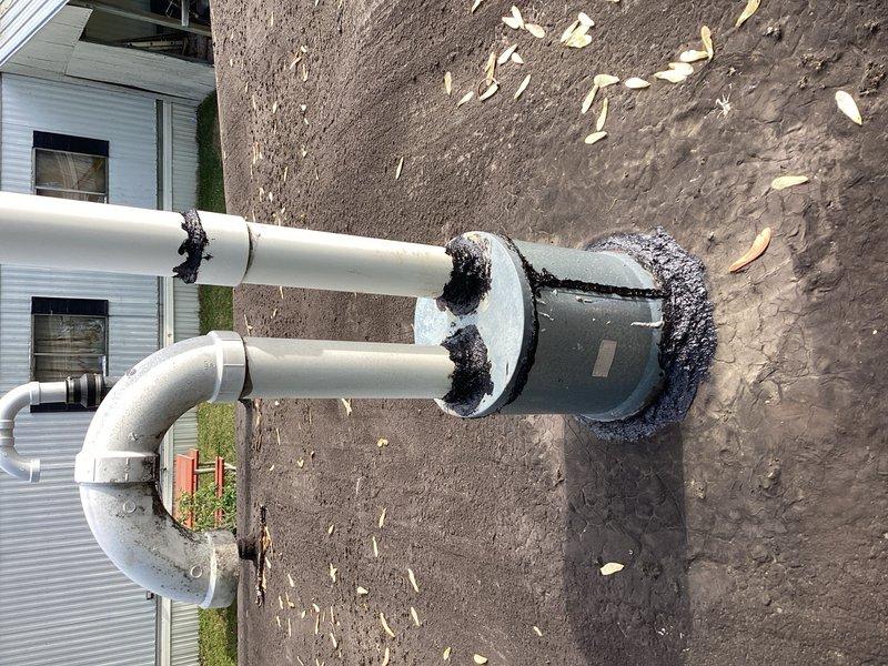 Responded to service call for water leakage from recently installed furnace vent during rain events. Upon inspection, discovered deteriorated sealant around roof jack and chimney penetration with significant cracks along seams allowing water infiltration. Re-sealed all compromised areas around roof jack penetration and advised that if leakage persists, complete roof jack replacement will be necessary. System operational with temporary repair in place.