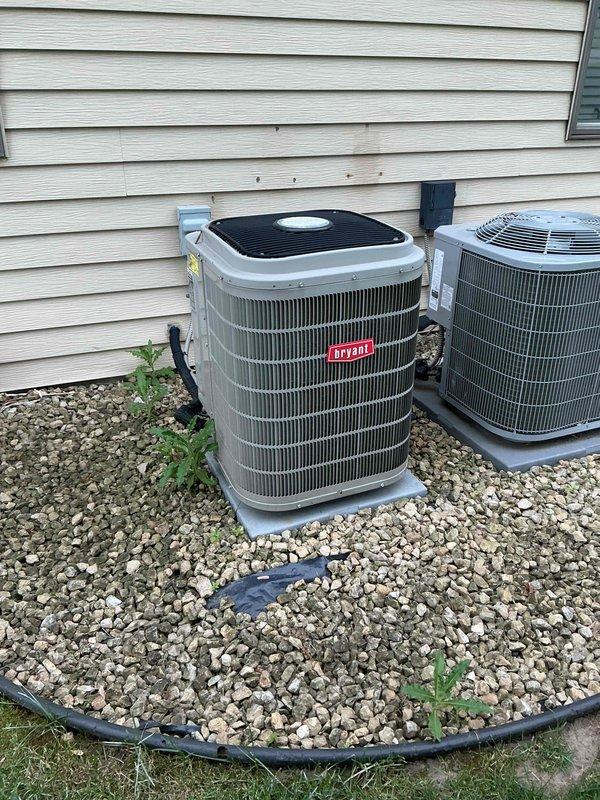 Performed spring AC tune-up on 10-year-old Bryant inverter system. Confirmed best contact number on file upon arrival. Conducted comprehensive inspection of cooling system components including outdoor condensing unit, indoor evaporator coil, and all associated equipment. Verified refrigerant charge levels are within manufacturer specifications. Inspected outdoor control board for proper operation and found all functions operating correctly. Examined outdoor condenser coil and confirmed clean condition with no blockages or debris accumulation. Checked air filter and verified clean status with adequate airflow. Measured supply and return air temperatures, confirming 20-degree temperature differential within acceptable range for optimal system performance. Inspected indoor evaporator coil and found clean with no dirt buildup or biological growth. Noted this inverter-style unit utilizes integrated control board technology rather than traditional contactor and capacitor components. Verified
