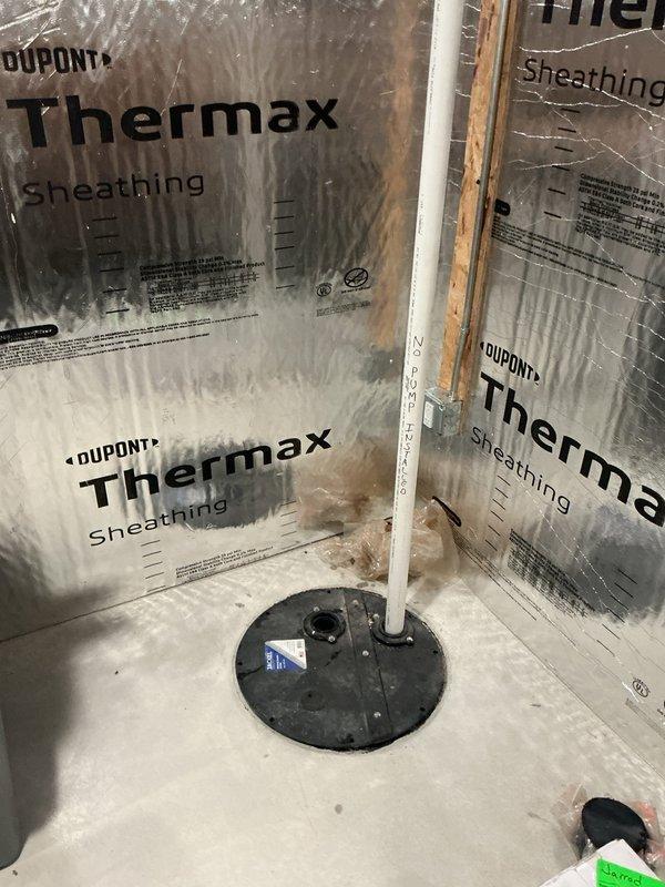 Provided comprehensive estimate for sump pump installation in basement addition with existing plumbing infrastructure in place. Assessed installation site showing prepared sump basin with discharge piping already roughed in through concrete floor, evaluated wall framing with thermal insulation barrier, and documented current pump mechanism and mounting configuration. Recommended complete sump pump system installation to address water management needs for the new addition.