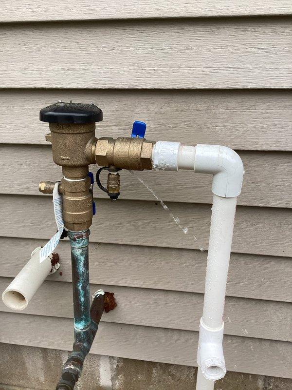 Responded to a leaking outdoor water shutoff valve for the sprinkler system. Upon inspection, identified the leak originating at the pressure vacuum breaker (PVB). Replaced the defective PVB with a new unit, tested the assembly for proper operation, and attached the required certification tag to document compliance with backflow prevention standards.