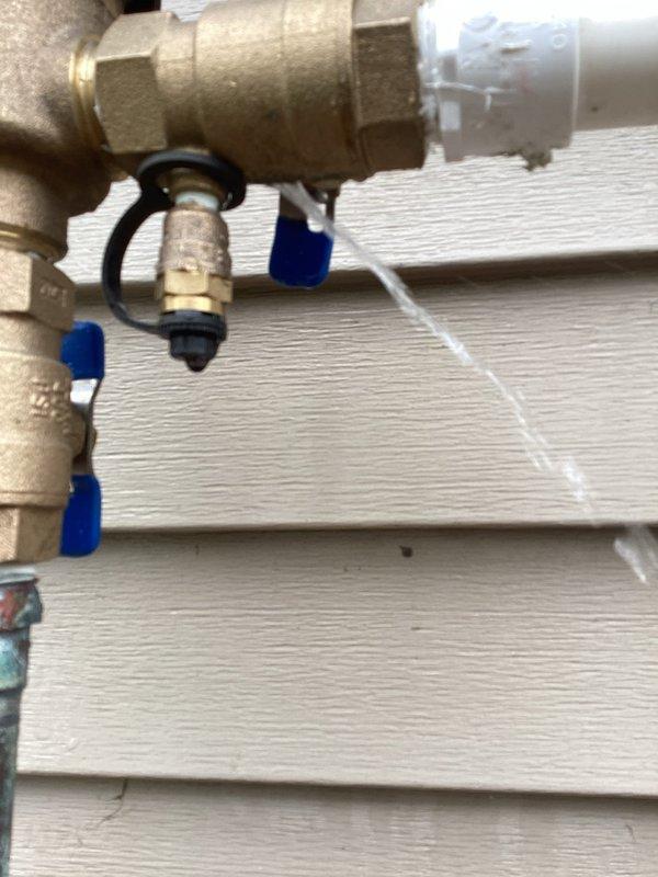 Responded to a leaking outdoor water shutoff valve for the sprinkler system. Upon inspection, identified the leak originating at the pressure vacuum breaker (PVB). Replaced the defective PVB with a new unit, tested the assembly for proper operation, and attached the required certification tag to document compliance with backflow prevention standards.
