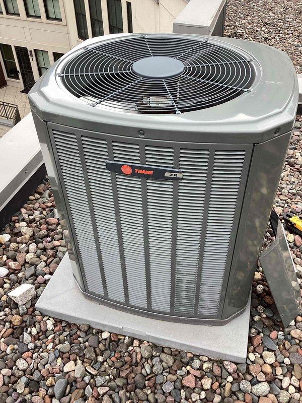 Completed annual spring cooling maintenance tune-up on Trane XT outdoor condensing unit as part of preventative maintenance agreement. Performed comprehensive system inspection, electrical diagnostics with multimeter, and verified proper operation of all components. No deficiencies noted, unit operating within normal parameters.