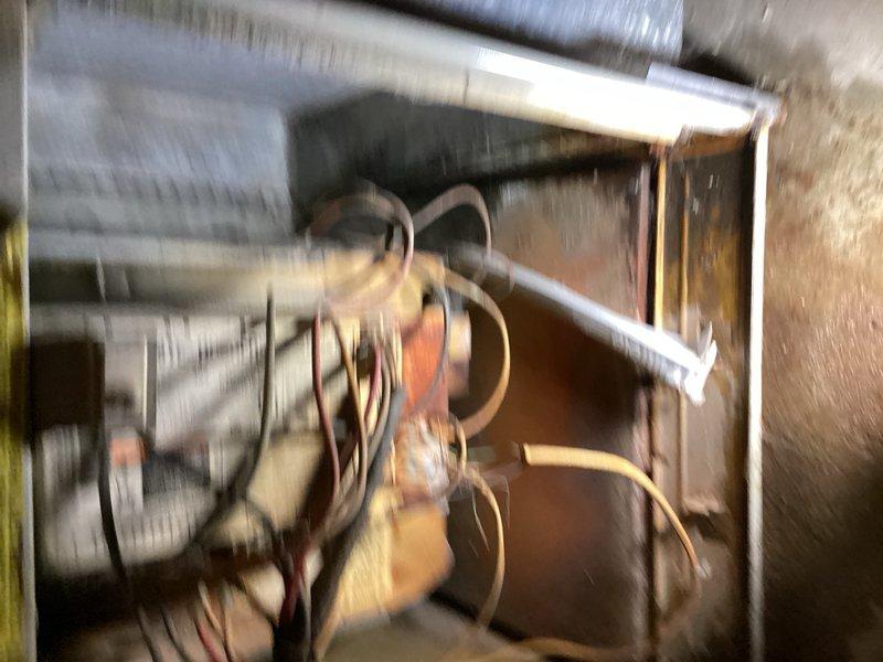Responded to no cooling complaint on 15-year-old air conditioning system. Upon arrival, found evaporator coil completely iced over with suction lineset frozen solid from evaporator to condenser unit. Performed diagnostic inspection of blower assembly, verified blower operation and speed settings within normal parameters. Inspected outdoor condenser unit including capacitor, contactor, and compressor components. Noted visible wear and stress damage on condenser components resulting from extended operation with frozen refrigerant lines. Unable to perform refrigerant charge verification due to ice blockage preventing accurate pressure readings. System requires further evaluation after ice melts and professional assessment for potential compressor damage and refrigerant loss. Comfort advisor scheduled for same day to provide replacement options given age of equipment and extent of component wear.