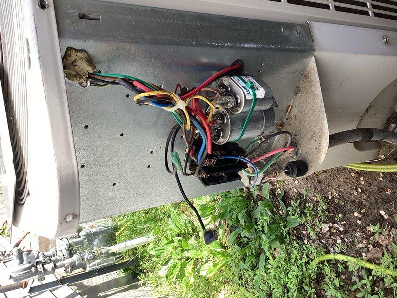 Responded to no cooling condition on 10-year-old residential air conditioning system. Upon arrival, confirmed heating and fan modes operational but compressor not engaging. Inspected outdoor unit and found shorted contactor and failed compressor start/protection device. Capacitor had been previously replaced with dual capacitor and separate single capacitor for fan motor, both tested within acceptable range. Tested system operation with replacement contactor, confirming compressor and condensing unit functioned properly. Also noted electrical disconnect box hanging loose from exterior wall mounting. Discussed findings and repair options, including recommendation to consider system replacement quotes given age and potential for additional component failures. Per homeowner request, secured electrical disconnect box to exterior wall. Homeowner declined contactor replacement at this time, electing to complete repair independently. System left in safe, non-operational condition pending cont