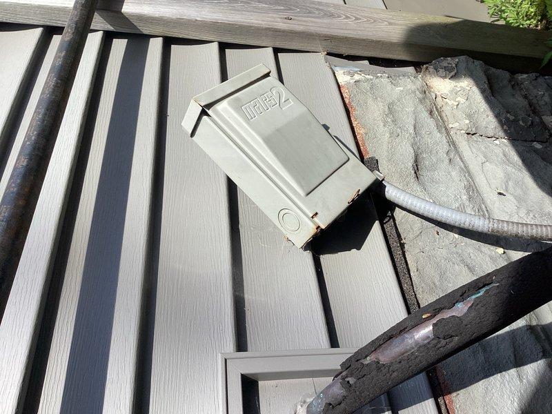 Responded to no cooling condition on 10-year-old residential air conditioning system. Upon arrival, confirmed heating and fan modes operational but compressor not engaging. Inspected outdoor unit and found shorted contactor and failed compressor start/protection device. Capacitor had been previously replaced with dual capacitor and separate single capacitor for fan motor, both tested within acceptable range. Tested system operation with replacement contactor, confirming compressor and condensing unit functioned properly. Also noted electrical disconnect box hanging loose from exterior wall mounting. Discussed findings and repair options, including recommendation to consider system replacement quotes given age and potential for additional component failures. Per homeowner request, secured electrical disconnect box to exterior wall. Homeowner declined contactor replacement at this time, electing to complete repair independently. System left in safe, non-operational condition pending cont