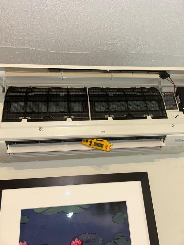 Responded to a no cool call on a 4-year-old Daikin mini split system experiencing intermittent cooling failure and error code blinking after approximately 3 hours of operation in any mode. Upon arrival, confirmed system was blowing warm air and discussed history of previous reinstallation due to poor original installation and subsequent line relocation. Investigated reported issue where all indoor heads synchronize modes and system requires circuit breaker reset to temporarily clear error codes, though results remain inconsistent. Inspected outdoor condenser unit and indoor wall-mounted head unit, checking filters which were found clean per homeowner maintenance. Evaluated system for potential causes including refrigerant issues, communication errors between heads and condenser, and electronic control board malfunctions. Noted one head unit is currently out of service due to damage and system uses discontinued refrigerant, making replacement parts unavailable. Performed diagnostic test