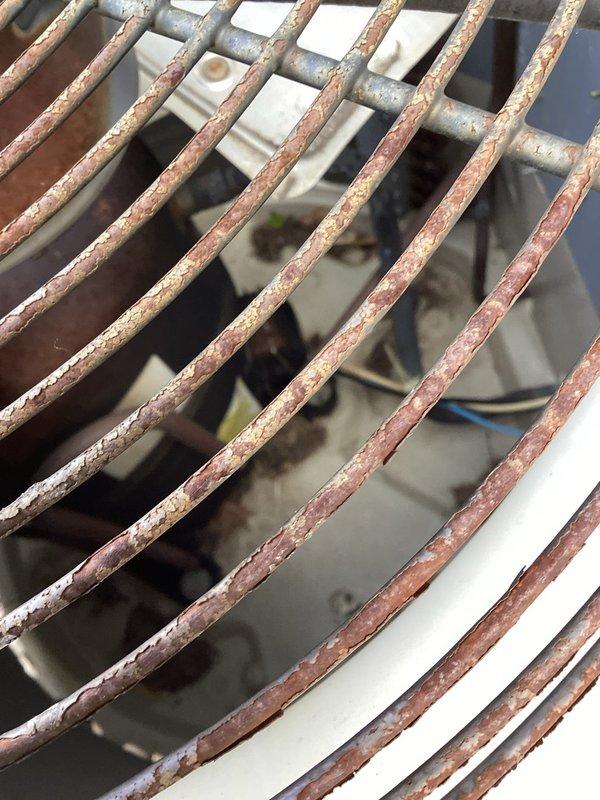 Responded to no cooling complaint on 20-year-old R22 system. Upon inspection, found low refrigerant charge at 4.05 lbs, indicating leak in aging system. Compressor and fan motor operational but insufficient refrigerant preventing proper cooling. Due to system age, R22 phase-out, cost of repairs, and overall condition showing significant corrosion and deterioration, recommended full system replacement rather than recharge and repair.