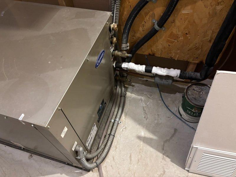 Responded to cooling complaint on 14-year-old geothermal system not maintaining thermostat setpoint. Upon inspection, found evaporator coil completely iced over with frozen lineset extending to geothermal heat pump. Identified root cause as insufficient airflow due to blower speed set incorrectly at low setting. Adjusted blower speed from low to medium-high to increase airflow across evaporator coil. Disabled cooling mode at thermostat and set fan to continuous operation to facilitate ice thaw process. Return visit required to verify complete system thaw and confirm proper cooling operation after airflow correction.