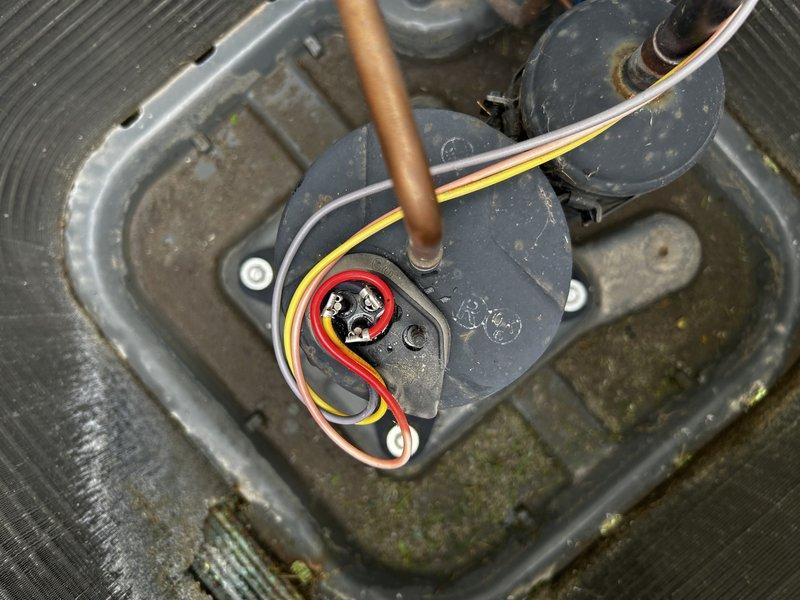 Responded to no cooling complaint on 14-year-old residential air conditioning system. Upon arrival, confirmed compressor was not operating while thermostat was set to 68°F with indoor temperature reading 77°F. Performed electrical diagnostics including capacitor testing, which passed within normal parameters. Conducted winding resistance tests on compressor motor and identified two of three windings testing open circuit, indicating internal compressor failure. Visual inspection revealed no external wiring damage or thermal failure indicators. Additionally noted significant corrosion damage to condenser coil, with exposed copper piping in one corner area and biological contamination present on coil surface. Documented findings with photographs of electrical components and equipment location. Recommended compressor replacement and condenser coil replacement due to extent of corrosion and contamination damage. Service advisor appointment scheduled for following day to provide replacement 