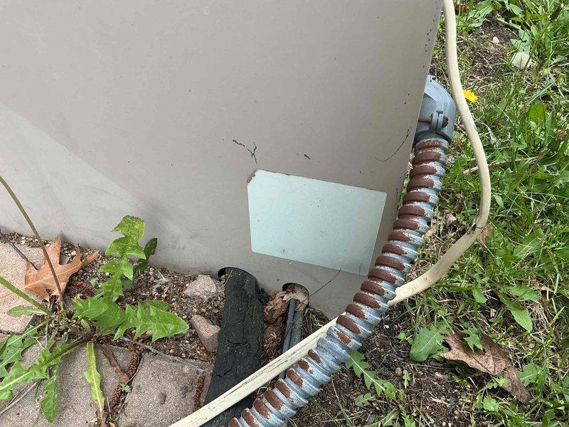 Responded to no cooling call on 30-40+ year old residential air conditioning system. Upon arrival, found rating plate worn off and illegible, preventing identification of model and specifications. Attempted system startup and heard contactor engage, but compressor and condenser fan failed to operate. Discovered circuit breaker had tripped or been manually shut off at electrical panel. Reset breaker and verified system operation—compressor and condenser fan started successfully and unit began cooling normally. Due to advanced age of equipment, limited parts availability, and cost considerations for repairs on systems of this vintage, recommended replacement over continued service. Coordinated comfort advisor appointment to discuss system replacement options, as homeowner expressed interest in new installation.