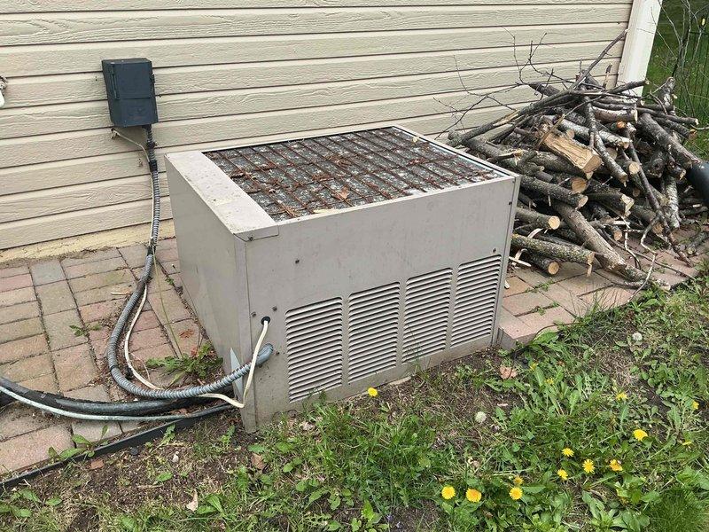 Responded to no cooling call on 30-40+ year old residential air conditioning system. Upon arrival, found rating plate worn off and illegible, preventing identification of model and specifications. Attempted system startup and heard contactor engage, but compressor and condenser fan failed to operate. Discovered circuit breaker had tripped or been manually shut off at electrical panel. Reset breaker and verified system operation—compressor and condenser fan started successfully and unit began cooling normally. Due to advanced age of equipment, limited parts availability, and cost considerations for repairs on systems of this vintage, recommended replacement over continued service. Coordinated comfort advisor appointment to discuss system replacement options, as homeowner expressed interest in new installation.
