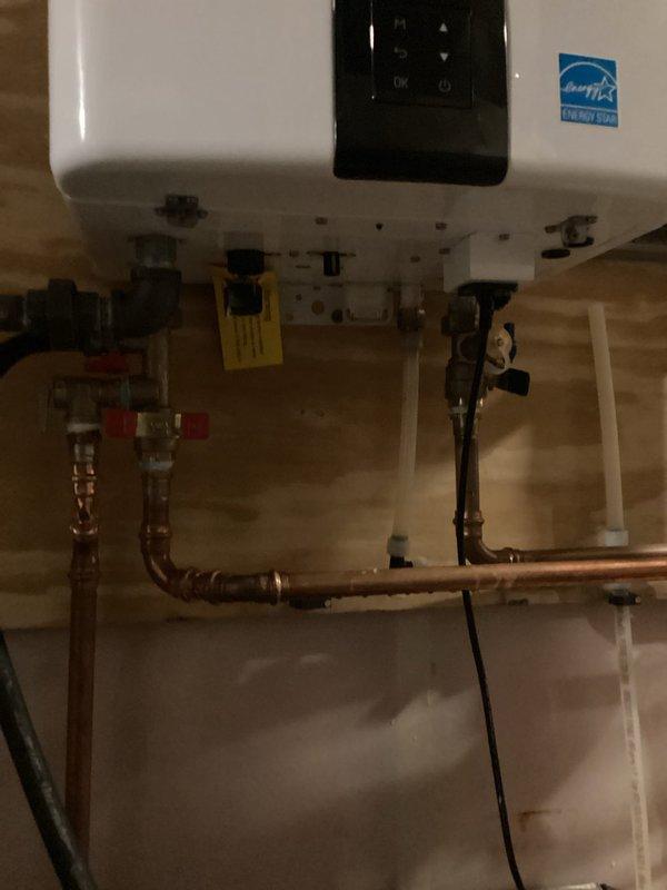 Performed routine maintenance flush on tankless water heater unit. Upon inspection, discovered isolation valves were installed upside down, which was corrected prior to service. Successfully repositioned valves to proper orientation and completed full system flush according to manufacturer specifications.