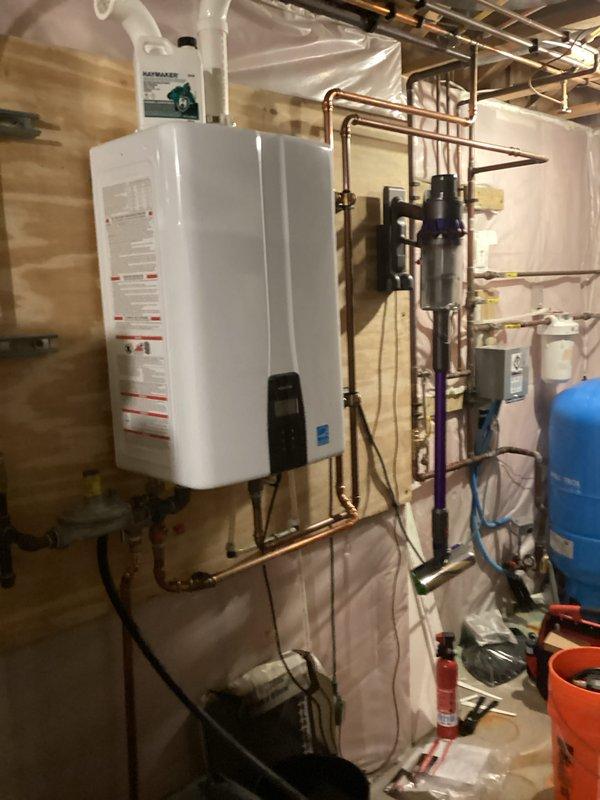 Performed routine maintenance flush on tankless water heater unit. Upon inspection, discovered isolation valves were installed upside down, which was corrected prior to service. Successfully repositioned valves to proper orientation and completed full system flush according to manufacturer specifications.