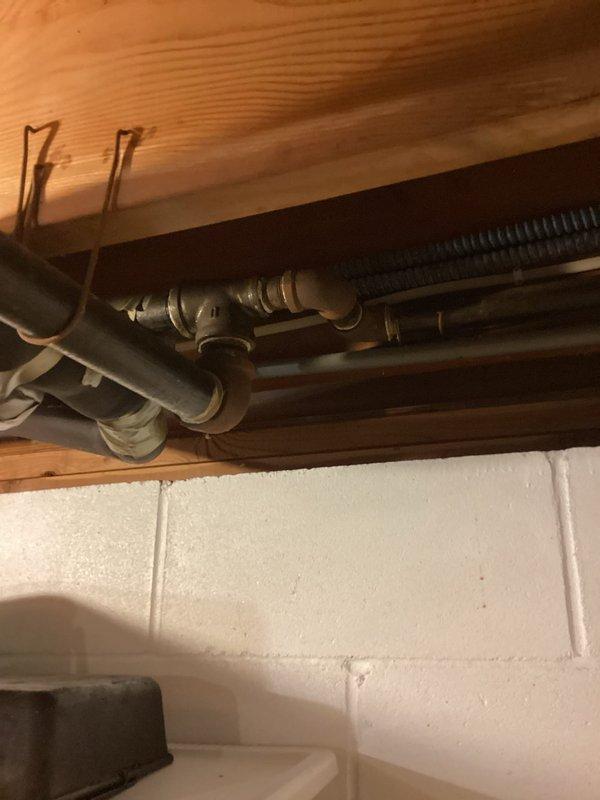 Responded to service call for underground gas leak preventing gas service to residence. Conducted thorough inspection of existing gas service line and documented conditions with photographs showing garage interior piping configuration and ceiling-mounted gas line connections with visible shut-off valves and corrugated flexible conduit. Assessed that underground gas service line requires complete replacement from street connection to home entry point to restore safe gas service to property.