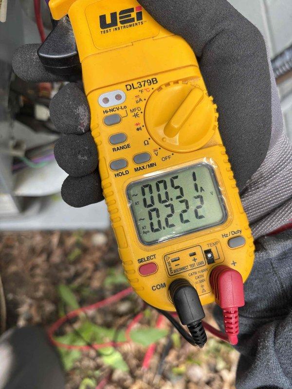Responded to no cooling complaint on residential air conditioning system. Upon arrival, found outdoor unit not receiving 24-volt power supply. Traced electrical issue to tripped GFCI outlet caused by failed condensate pump that was full of water. Reset GFCI and confirmed condensate pump resumed operation, restoring power to outdoor unit.

Performed system diagnostics and measured temperature split at only 13 degrees, indicating inadequate cooling performance. Checked refrigerant pressures and identified elevated head pressure. Inspected outdoor condenser coil and found heavy dirt accumulation restricting airflow. Cleaned condenser coil thoroughly, resulting in refrigerant pressures returning to normal operating range. Rechecked temperature split, which improved to 15 degrees and within acceptable parameters.

Identified additional maintenance items requiring attention: capacitor showing signs of wear and condensate pump at end of service life. Provided estimates for dual-run capacitor 