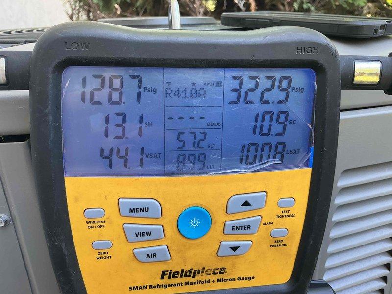 Responded to no cool complaint on residential air conditioning system under warranty. Upon arrival, confirmed unit was blowing warm air with previous coil cleaning already attempted. Performed diagnostic testing with refrigerant manifold gauges and identified system was significantly low on refrigerant charge. Recharged system to manufacturer specifications and added UV dye to refrigerant circuit to facilitate future leak detection. Verified proper superheat and subcooling readings after recharge, restoring cooling operation. Recommended follow-up appointment for comprehensive leak search and repair to address underlying refrigerant loss issue.